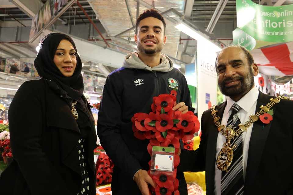 Footballer kicks off Poppy Appeal at Blackburn Market